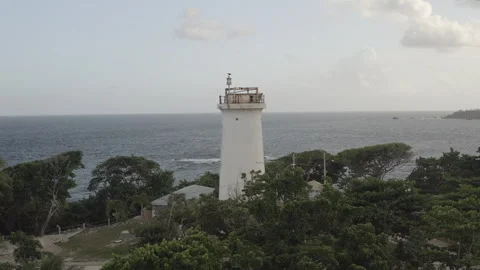 Medium aerial circles around Toco lighthouse in northeastern tip of Trinidad 스톡 동영상 261925559
