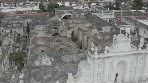 Medium aerial sails over the open ruins of the main church of Antigua, Guatemala Stock-Footage 167927995