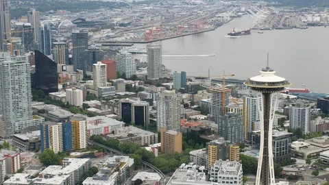 Medium Aerial of Seattle Space Needle, Downtown and Shipyard Stock Footage 114387250