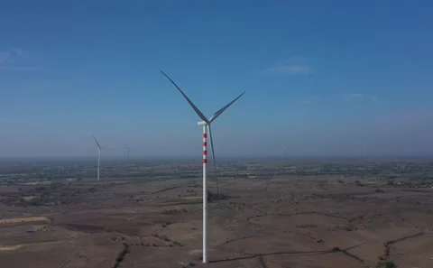 Medium Aerial Shot Focused on Single Spinning Windmill Blade Structure Vídeo Stock 342488913