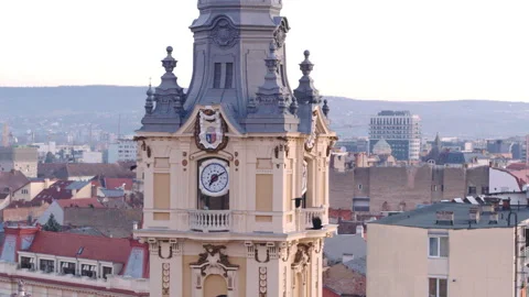 Medium aerial shot panning around the ornate City Hall clock tower in Stock Footage 339641619