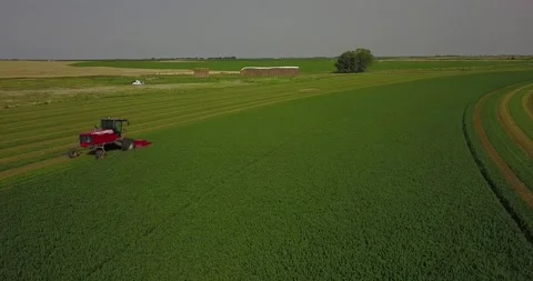 Medium Aerial of a Swather - Push in Stock Footage 221861964