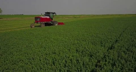 Medium Aerial of a Swather - Slide Forward Stock Footage 221861935