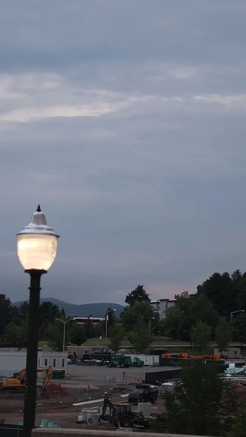 Medium angle shot of a lampost and a construction site in the back ground Stock Footage 202275328