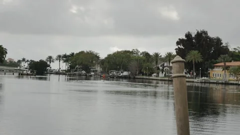 Medium angle view looking south Coffee Pot Bay in Saint Petersburg, FL. Man on p Stock Footage 268773934