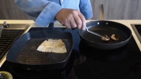 Medium of calamari cooking on a pan Stock Footage 119163139