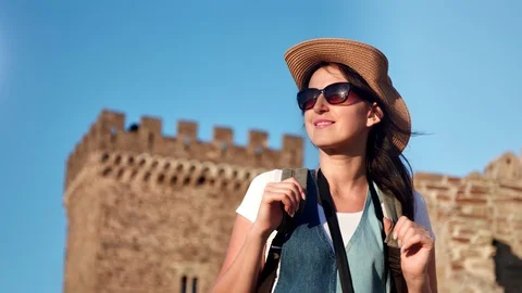 Medium close-up attractive smiling young travel woman in hat and sunglasses Stock Footage 111474095