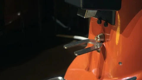 Medium close up of barista hand inserts a holder into a coffee grinder Stock Footage 127586626