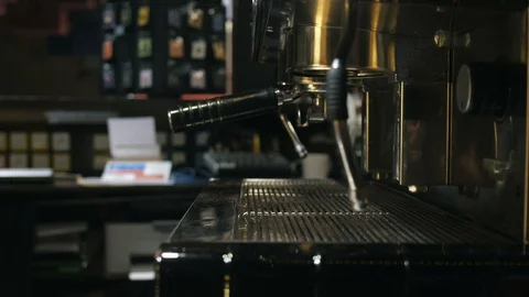 Medium close up of barista hand setting the holder to the coffee machine Stock Footage 127587310