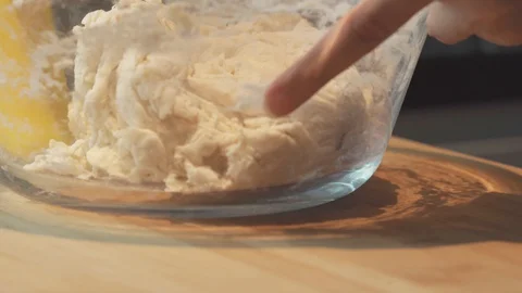 Medium close up cleaning a table for hand kneading a bread dough table Stock Footage 127956204
