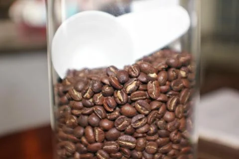 Medium close up of coffee beans in a glass jar Stock Photos