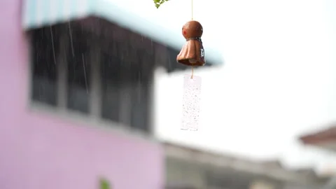 Medium Close up The doll asks for rain on a really rainy day. Stock-Footage 138072379