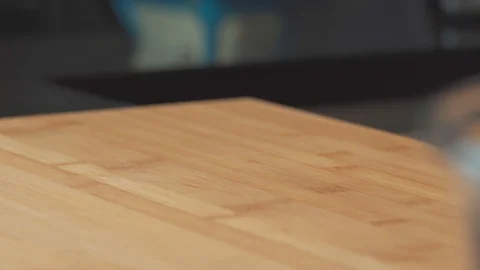 Medium close up dumping a loaf of dough bread pizza on table for hand knead Stock Footage 127957004