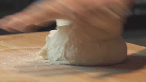 Medium close up hand knead a bread dough at home smooth Stock Footage