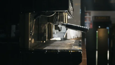 Medium close up of hand washing holder under the water jet of coffee machine Stock Footage 127586345