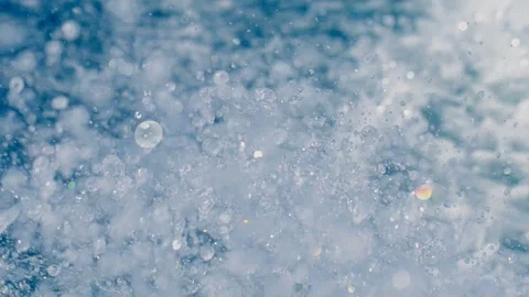 Medium close up handheld shallow depth of field shot swelling foamy splashing Stock Footage 102378903