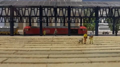 Medium Close Up of Hornby Train Scale Model Passing Station Stock Footage 284231704