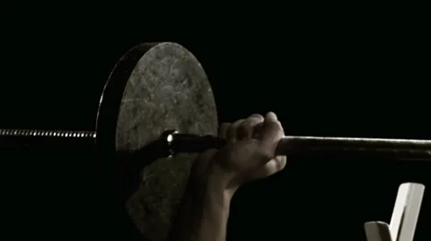 Medium Close up of man bench pressing weights Video stock 33831261