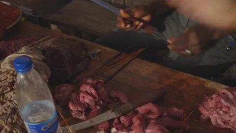 Medium Close Up Man Cut and Prepare Meat Skewer Outdoor Stock Footage 181965326
