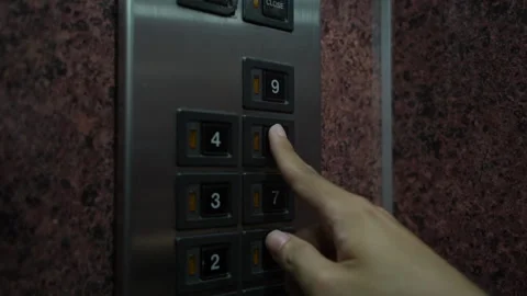 Medium close up, A man uses an elevator with other people during COVID-19. Видео 137284574