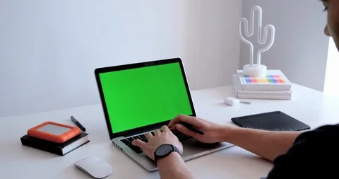 Medium close up of a man working, drawing, sketching on a laptop with a grap Stock Footage 127085227