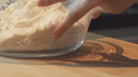 Medium close up mixing dough flour wheat using hand for pizza bread Stock Footage 127956054
