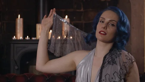 Medium close up of model on sofa Stock Footage 109488760