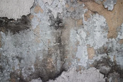 Medium close up of an old colonial wall in Asia with a variety of textures in Stock Photos