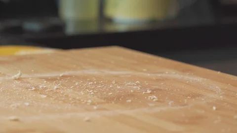 Medium close up shot cleaning hand from drying dough after hand kneading Stock Footage 127961178