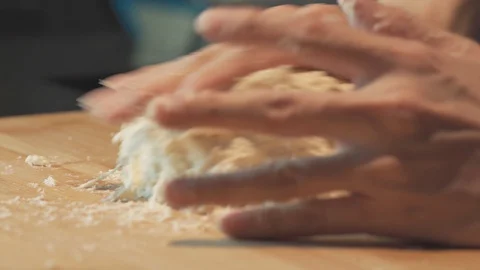 Medium close up shot hand kneading still wet dough sticky high hydration bread Stock Footage 127957251