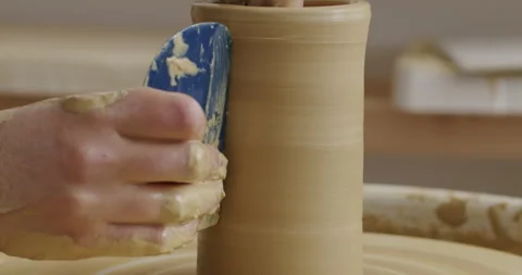 Medium close up shot of hands working with different tools on a spinning Stock Footage 277212511