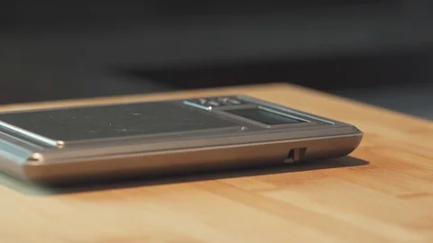 Medium close up shot measuring a yeast on a scale for baking dough home cooking Stock Footage 127952911