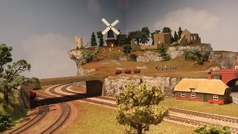 Medium Close up Shot of Train Scale Model Passing Village Stock Footage 289550934