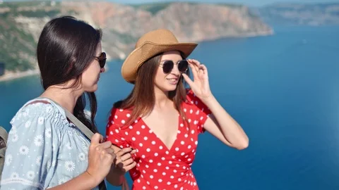 Medium close-up two attractive gossip young woman enjoying discussing admiring Stock Footage 111871397