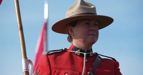 Medium closeup of female officer of Royal Canadian Mounted Police, slow Stock Footage