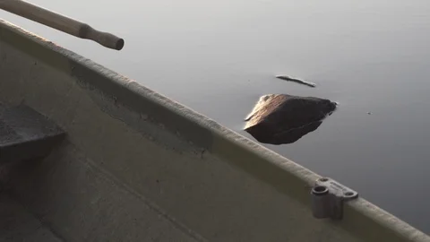 Medium closeup shot of a rowboat on a lake in Finland Stock Footage 113865437