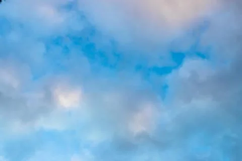 Medium dark clouds against a blue sky Stock Photos