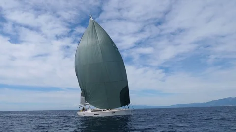 Medium distance shot of full sail boat   Stock Footage 82466042