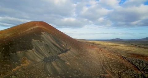Medium drone shot of volcanic mountain in Fuerteventura. Stock Footage 105064258