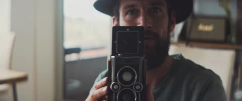 Medium format photographer directing the scene with his hands Video stock 202248943