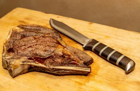 Medium Fried Tomahawk Steak with Knife Stock Photos