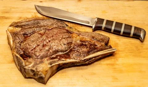 Medium Fried Tomahawk Steak with Knife Stock Photos