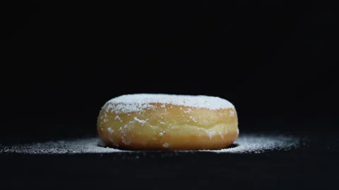 Medium front shot strew icing sugar to donut Видео 135860603