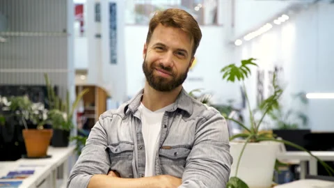 Medium front view shot of young entrepreneur confidently looking at camera with Stock Footage 277955647