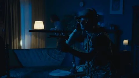 Medium-full photo capturing two ghost hunters entering a dark room in search for Stock Photos