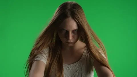 Medium green screen, chroma key shot of a posessed female, woman figure, ghost Foto stock