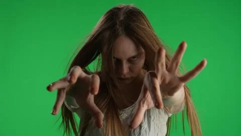 Medium green screen, chroma key shot of a posessed female, woman figure, ghost Stockfoto's