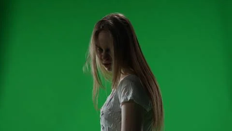 Medium green screen, chroma key shot of a posessed female, woman figure, ghost 스톡 사진