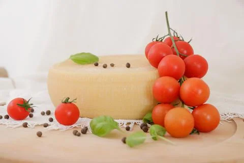 Medium hard cheese head parmesan on wooden board, with cheese parmesan with t 写真素材