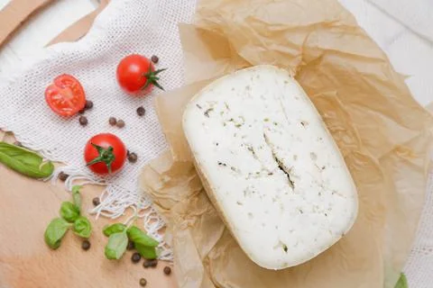 Medium hard cheese head parmesan on wooden board, with cheese parmesan with t 写真素材